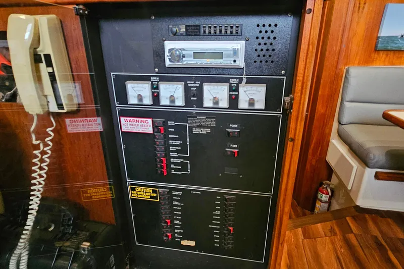 Slide: The Image of Electrical panel inside a 1994 Carver 390 Cockpit Motor Yacht, featuring gauges and controls. - 20