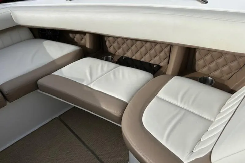 Slide: The Image of Luxurious seating in a 2014 Cobalt 302 boat with quilted upholstery and cup holders. - 11