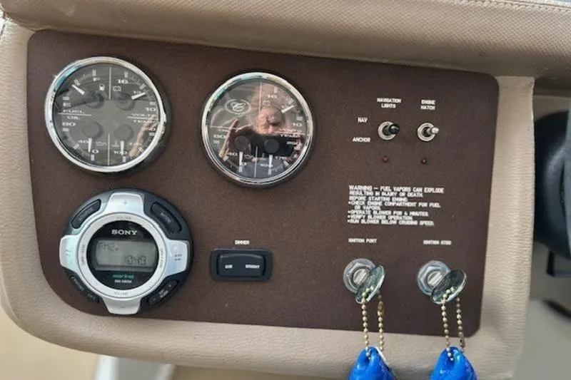 Slide: The Image of Dashboard of a 2014 Cobalt 302 boat with gauges and controls. - 18