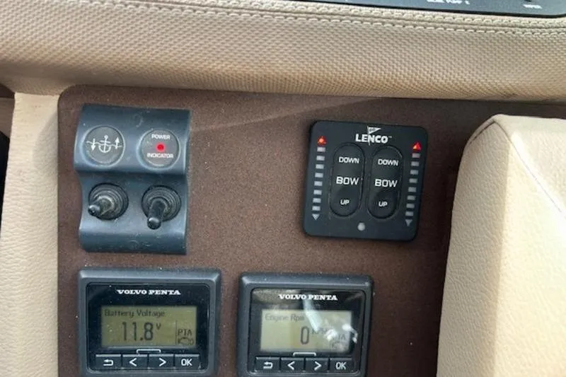 Slide: The Image of Control panel of a 2014 Cobalt 302 boat with Lenco trim tabs and Volvo Penta displays. - 20
