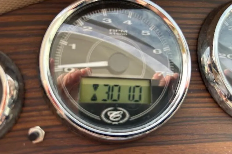 Slide: The Image of Close-up of 2014 Cobalt 302 boat tachometer displaying 301.1 hours. - 22