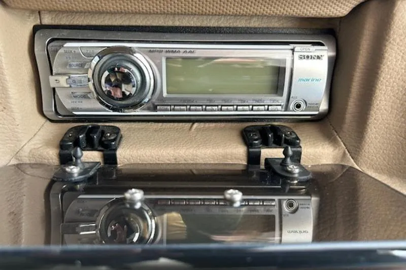 Slide: The Image of 2014 Cobalt 302 boat stereo system with marine audio controls. - 3