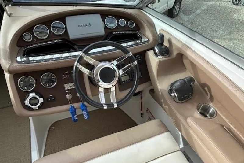 Slide: The Image of 2014 Cobalt 302 boat dashboard with Garmin navigation and modern controls. - 5