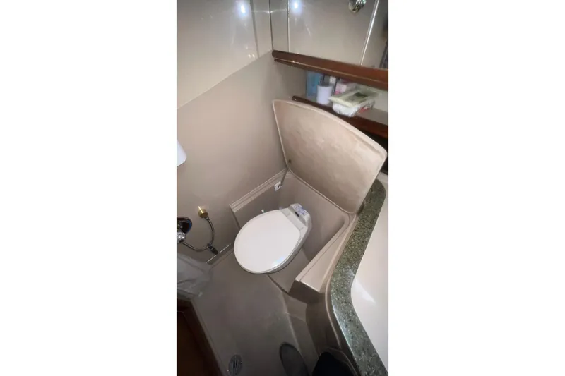 Slide: The Image of Bathroom interior of 2001 Cruisers Yachts 3572 Express with toilet and vanity. - 25