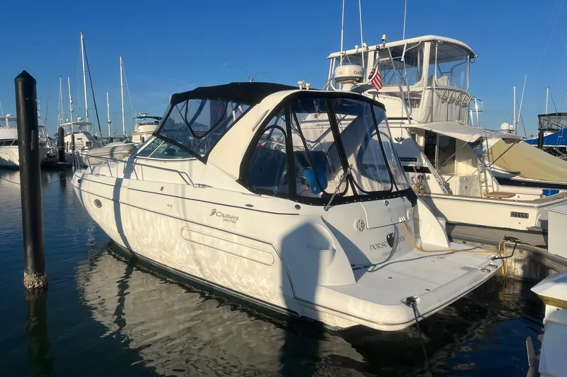 Slide: The Image of 2001 Cruisers Yachts 3572 Express docked at marina, sunny day, clear blue sky. - 3