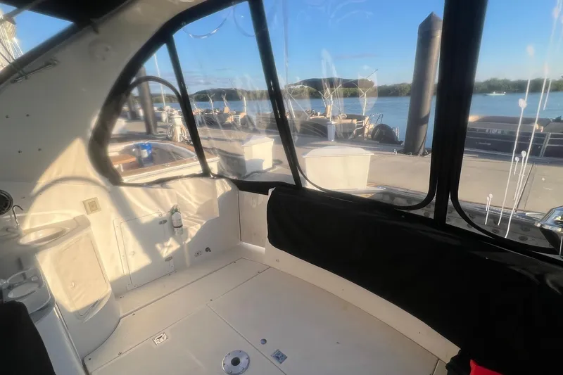 Slide: The Image of Interior view of 2001 Cruisers Yachts 3572 Express with dockside scenery. - 6