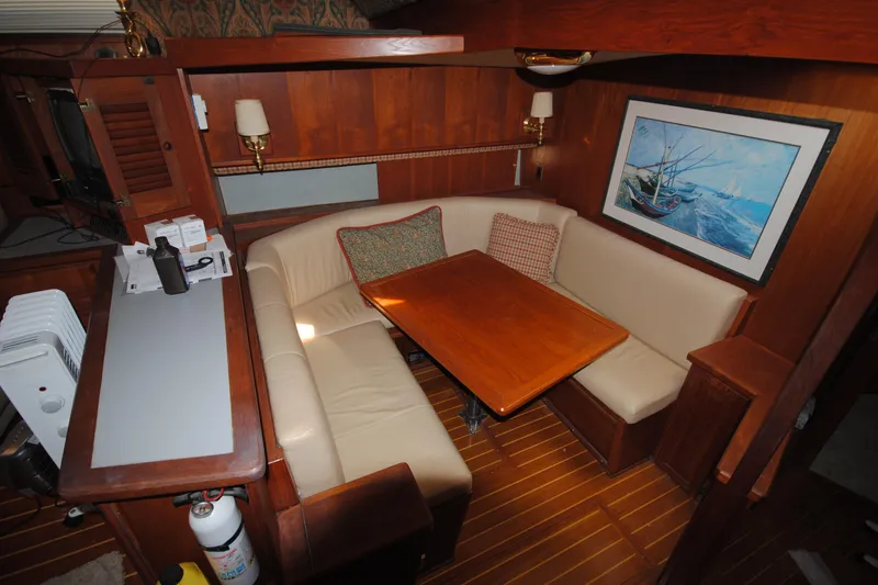 Slide: The Image of Interior of 1986 Viking 50 Motor Yacht with cozy dining area and nautical decor. - 31