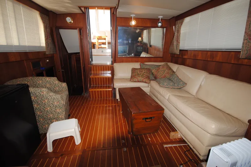 Slide: The Image of Interior of 1986 Viking 50 Motor Yacht with leather seating and wooden flooring. - 35