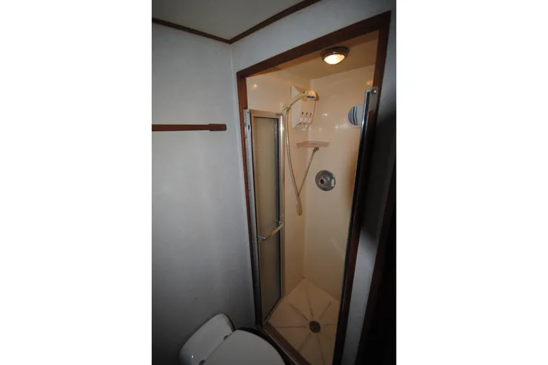 Slide: The Image of Shower area in 1986 Viking 50 Motor Yacht bathroom, featuring compact design and modern fixtures. - 37