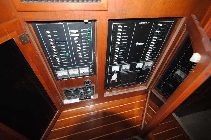 Slide: The Image of Electrical control panel on 1986 Viking 50 Motor Yacht, featuring switches and gauges. - 49