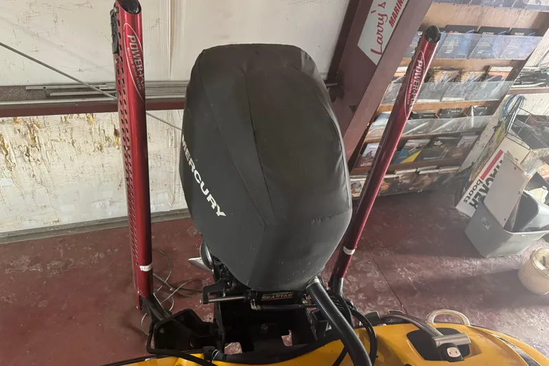 Slide: The Image of 2015 Nitro Z-9 DC boat engine with Mercury cover and Power-Pole anchors in a garage. - 7