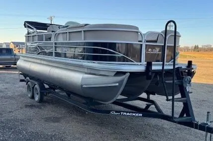 Slide: The Image of 2018 Sun Tracker Party Barge 22 XP3 pontoon boat on trailer, parked outdoors. - 3