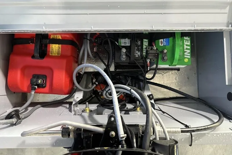 Slide: The Image of 2026 Tracker Bass Tracker Classic CC boat engine compartment with fuel tank and battery. - 20