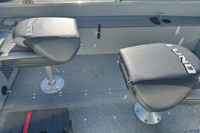 Slide: The Image of 2024 Lund 1400 Fury SS boat interior with two cushioned seats. - 11