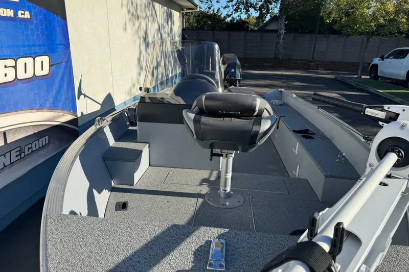 Slide: The Image of 2024 Lund 1400 Fury SS fishing boat interior with seating and equipment. - 5