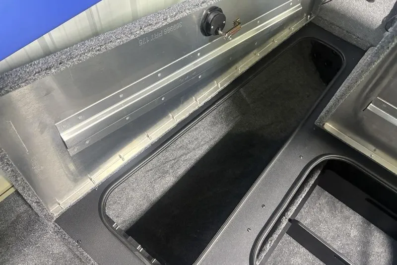 Slide: The Image of Open storage compartment in 2026 Tracker Pro Team 175 boat. - 11