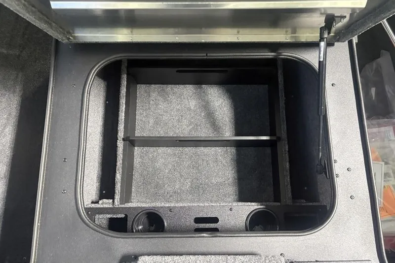 Slide: The Image of 2026 Tracker Pro Team 175 storage compartment with open lid, showcasing interior space. - 24