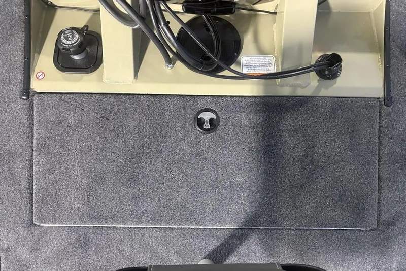 Slide: The Image of Interior view of 2026 Tracker Pro Team 175 boat, featuring carpeted flooring and control panel. - 28