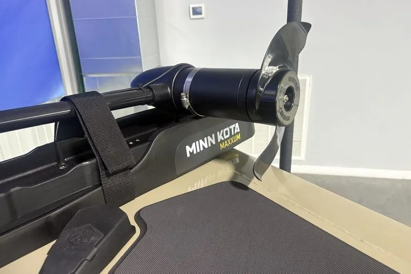 Slide: The Image of 2026 Tracker Pro Team 175 boat storage compartment with open lid, showcasing interior space. - 9