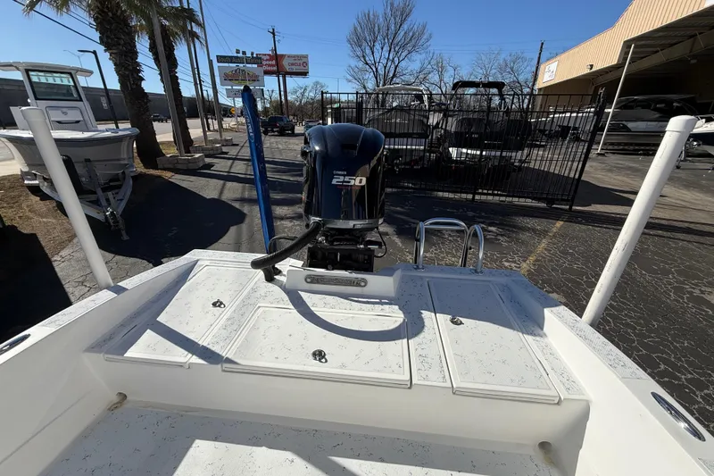 Slide: The Image of 2018 Shallow Sport 24 Modified V boat with Yamaha 250 engine in outdoor setting. - 21