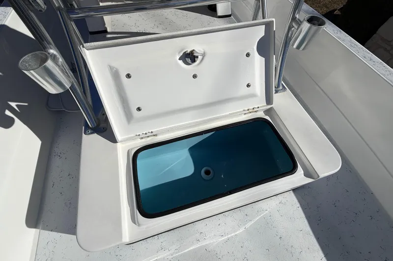 Slide: The Image of 2018 Shallow Sport 24 Modified V boat with open storage compartment. - 30