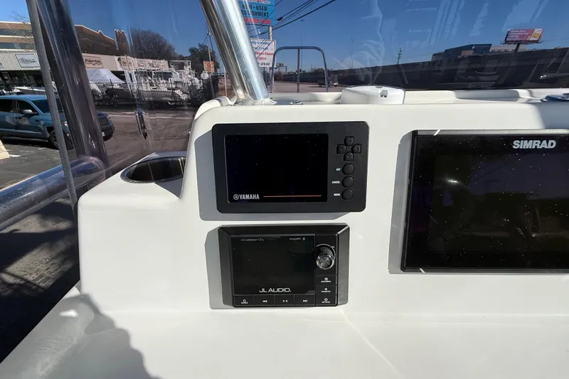 Slide: The Image of 2018 Shallow Sport 24 Modified V boat dashboard with Yamaha and Simrad displays. - 36