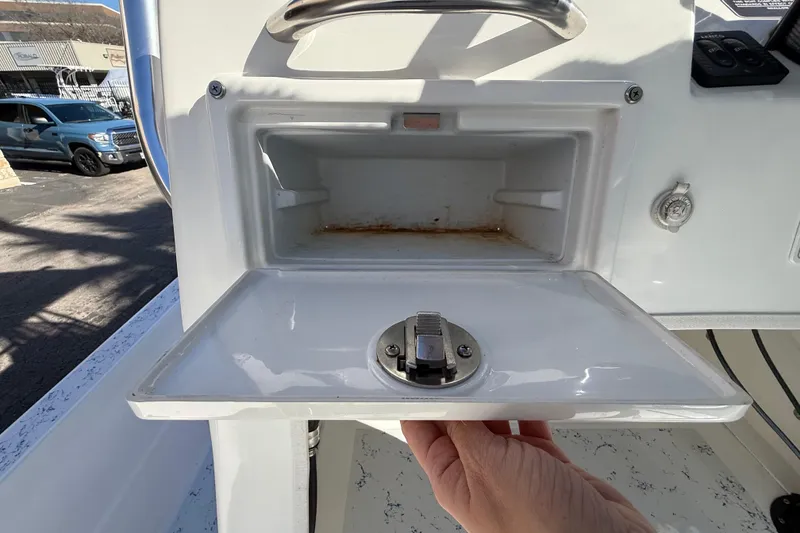 Slide: The Image of Open storage compartment on 2018 Shallow Sport 24 Modified V boat. - 37