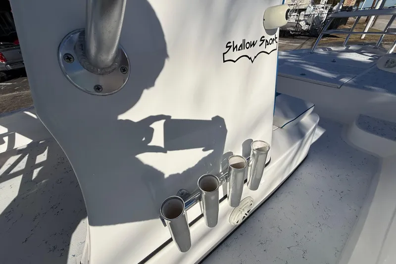 Slide: The Image of 2018 Shallow Sport 24 Modified V boat with rod holders and logo. - 44