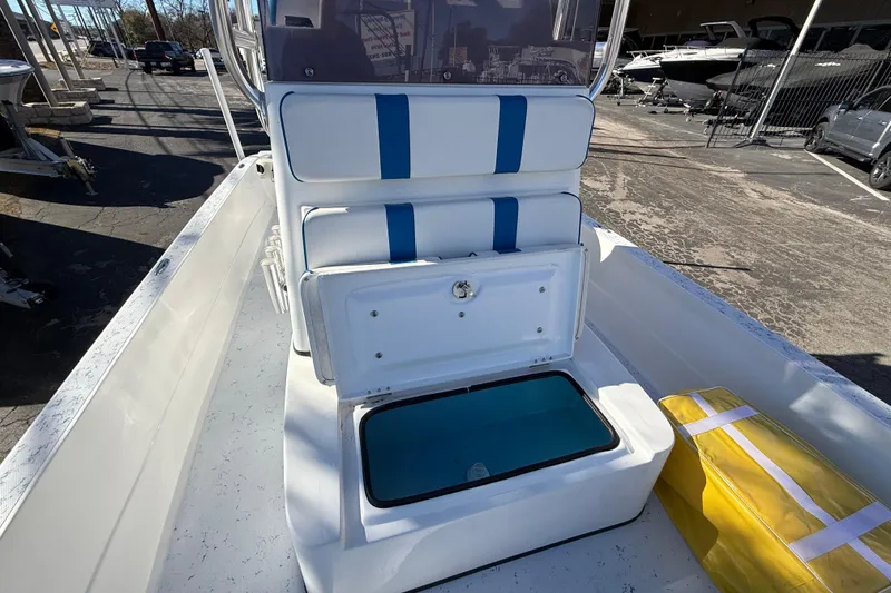 Slide: The Image of 2018 Shallow Sport 24 Modified V boat interior with seating and storage compartments. - 46