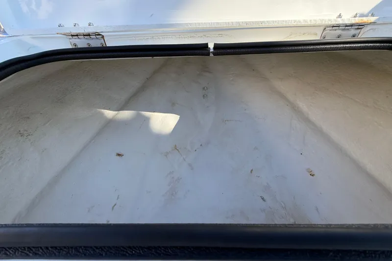 Slide: The Image of Open storage compartment of 2018 Shallow Sport 24 Modified V boat. - 51