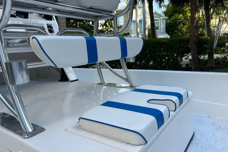 Slide: The Image of 2018 Shallow Sport 24 Modified V boat interior with blue and white seating. - 6