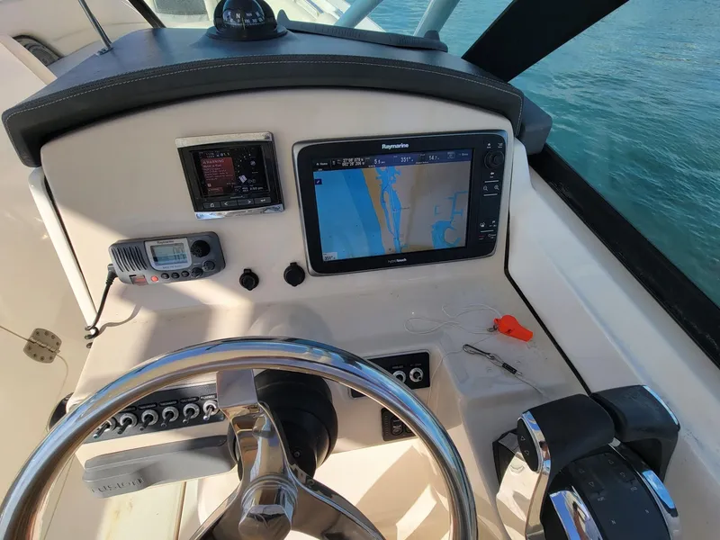 Slide: The Image of 2015 Boston Whaler 270 Vantage helm with navigation system and controls. - 3