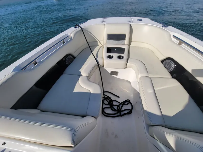 Slide: The Image of 2015 Boston Whaler 270 Vantage boat interior with white seating and ocean view. - 4
