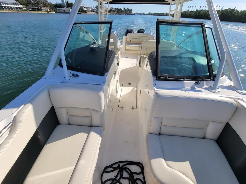 Slide: The Image of 2015 Boston Whaler 270 Vantage boat interior with seating, on a sunny day. - 5