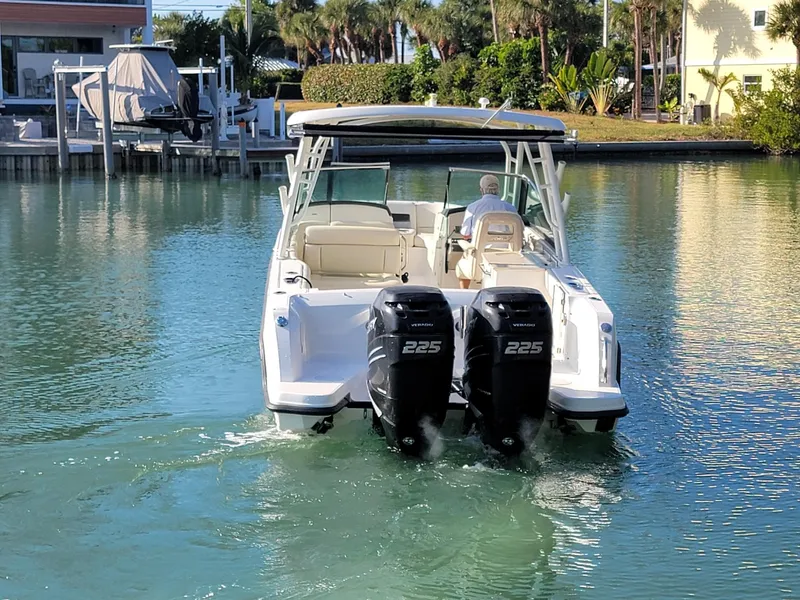 Slide: The Image of 2015 Boston Whaler 270 Vantage boat with dual engines on calm water. - 7
