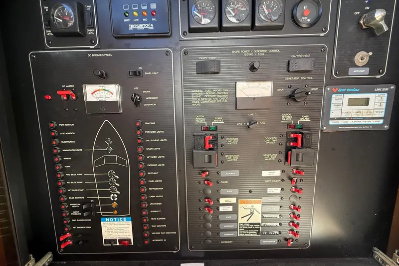 Slide: The Image of Control panel of a 1995 Bayliner 39 Motoryacht, featuring gauges and switches. - 12
