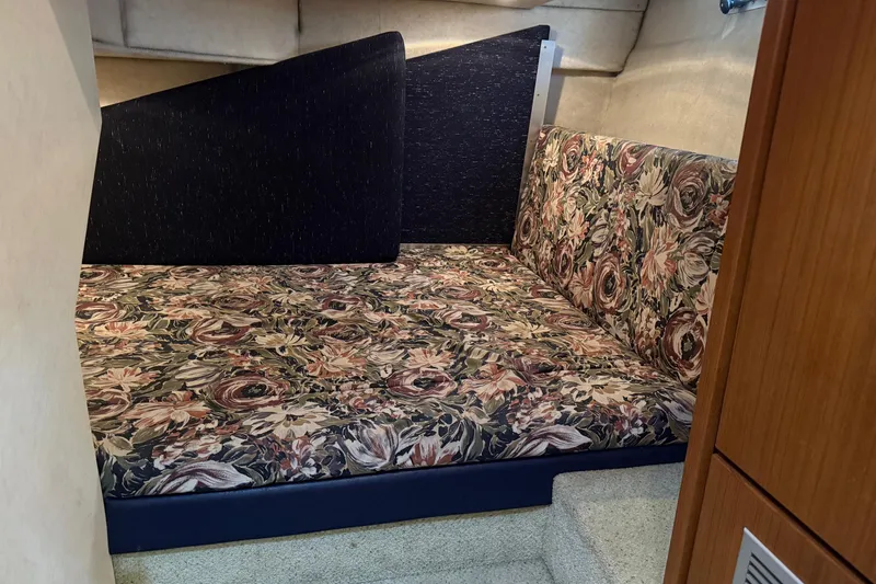 Slide: The Image of Floral-patterned seating area inside 1995 Bayliner 39 Motoryacht cabin. - 18