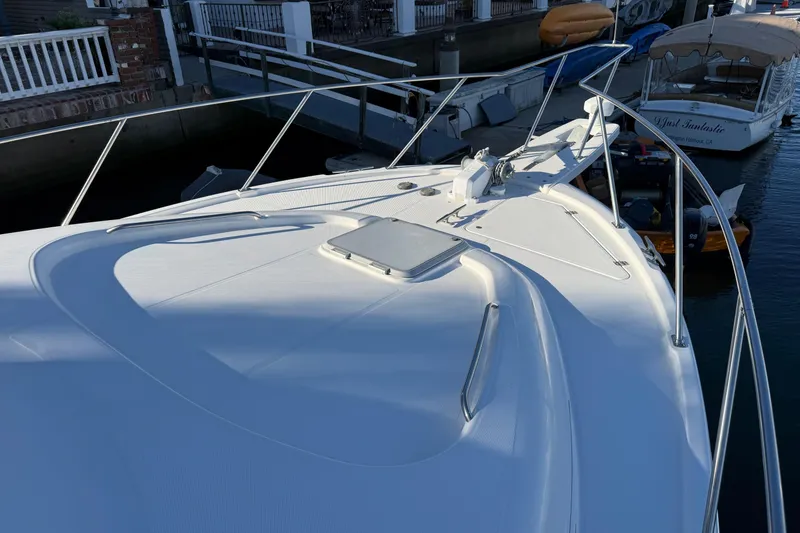 Slide: The Image of 1995 Bayliner 39 Motoryacht bow view at marina dock. - 25