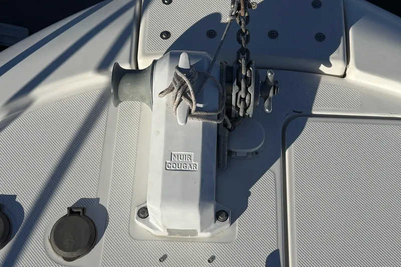 Slide: The Image of Anchor winch on 1995 Bayliner 39 Motoryacht deck, featuring Muir Cougar branding. - 26