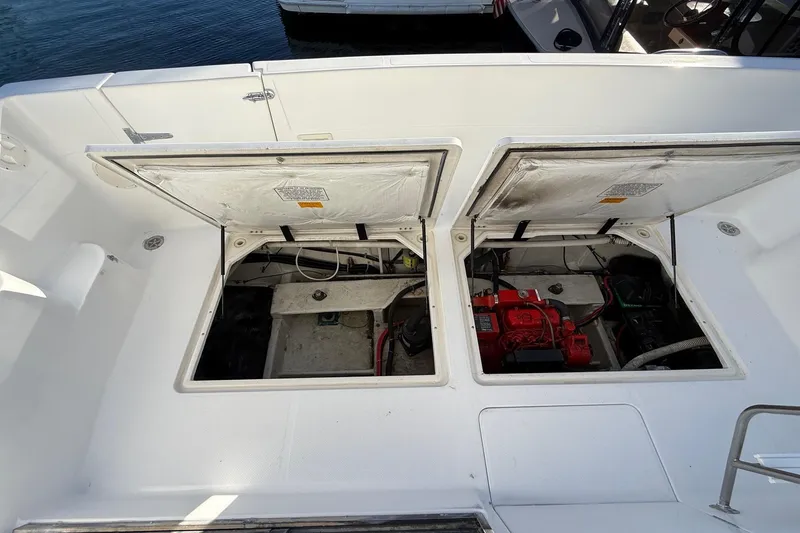 Slide: The Image of 1995 Bayliner 39 Motoryacht engine compartment with open hatches, revealing mechanical components. - 29