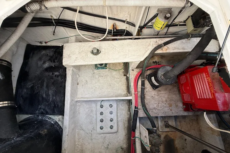 Slide: The Image of Engine compartment of a 1995 Bayliner 39 Motoryacht, showing wiring and mechanical components. - 30