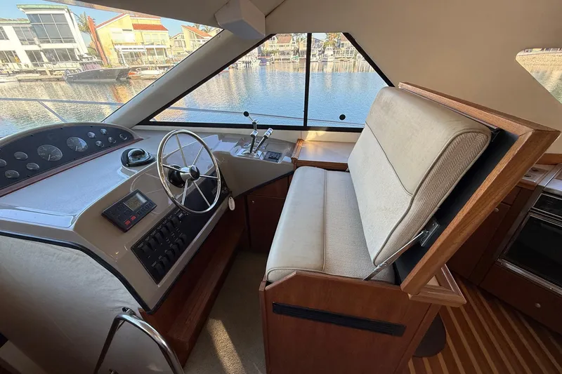Slide: The Image of Interior helm of 1995 Bayliner 39 Motoryacht with steering wheel and controls. - 5