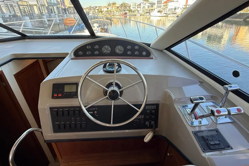 Slide: The Image of Helm of 1995 Bayliner 39 Motoryacht with steering wheel and control panel. - 6