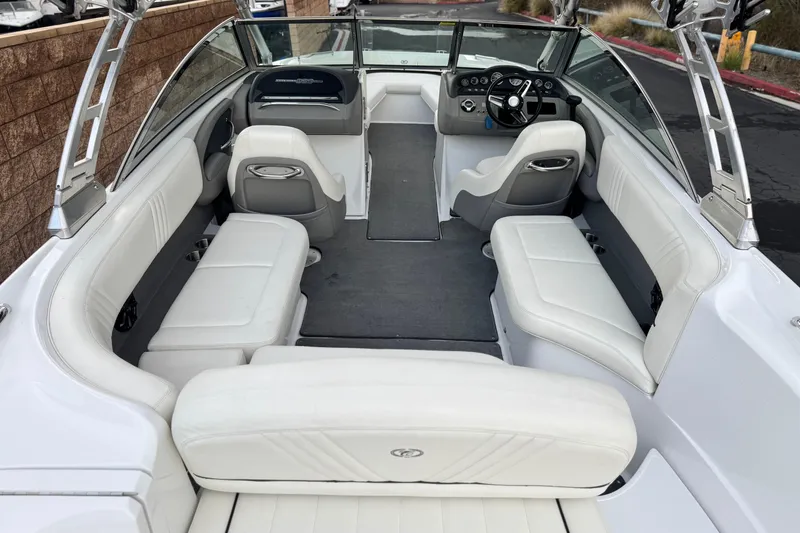 Slide: The Image of 2014 Cobalt 262 WSS boat interior with white seating and sleek design. - 10