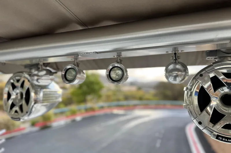 Slide: The Image of 2014 Cobalt 262 WSS boat speakers and lights on a metal frame. - 12