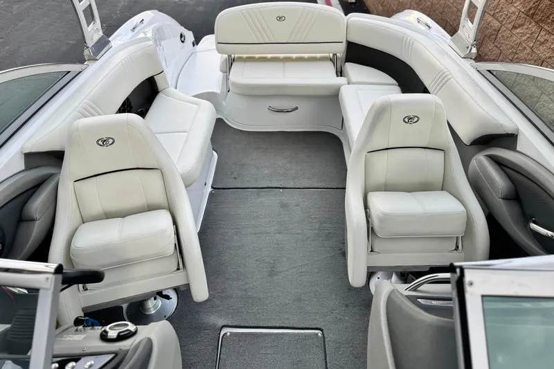 Slide: The Image of 2014 Cobalt 262 WSS boat interior with white seating and gray carpet. - 21