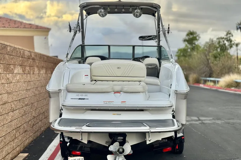 Slide: The Image of 2014 Cobalt 262 WSS boat, rear view, parked on a paved road. - 4