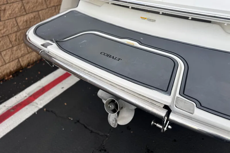 Slide: The Image of 2014 Cobalt 262 WSS boat stern with swim platform and propeller. - 7