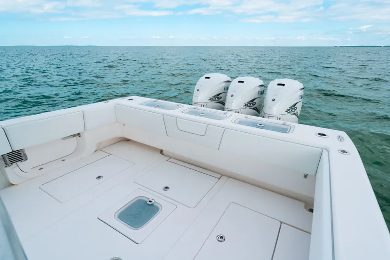 Slide: The Image of 2021 Contender 44 ST boat with triple Yamaha engines on open sea. - 16