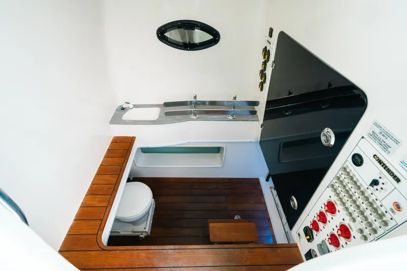 Slide: The Image of 2021 Contender 44 ST boat interior with wooden flooring and control panel. - 20